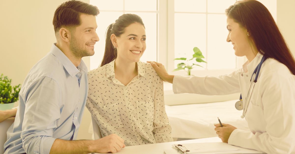 couple consulting with fertility doctor