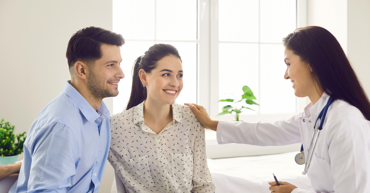 fertility doctor consulting with a couple