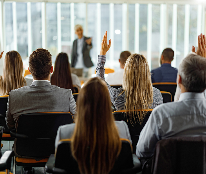 event speaker being asked a question by attendees